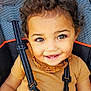 Raina joined the competition — help win amazing prizes! accessories, baby, babylaughing, brownhair, clothing, curlyhair, dimples, face, hair, happy, head, person, photography, portrait, sleeve, smile, strap, suspenders, sword, weapon