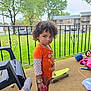 Raina is registered to the contest to win money with this photo: backyard, child, clothing, curlyhair, face, female, girl, grass, hair, head, hosiery, nature, outdoors, park, person, photography, plant, portrait, sock, yard