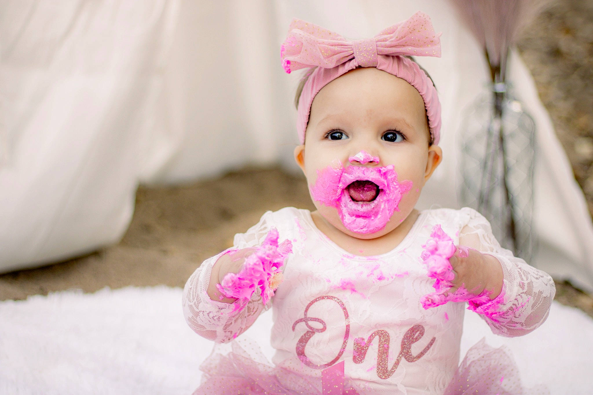 Kynleigh is registered to the contest to win money with this photo: baby, baby_toddler_clothing, child, clothing, eye, face, facial_expression, gesture, happy, head, headgear, headwear, iris, lip, mouth, nose, person, pink, skin, smile