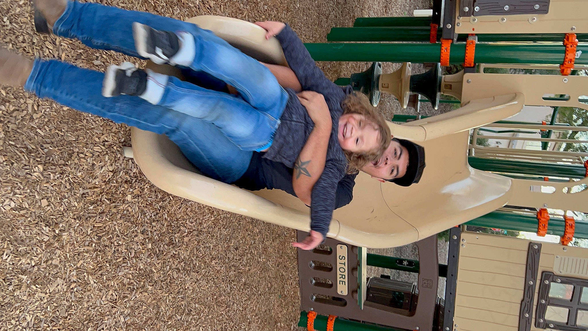 Ryker is registered to the contest to win money with this photo: arm, child, comfort, denim, elbow, electric_blue, engineering, fun, headwear, human_leg, joy, knee, leisure, machine, person, recreation, room, sandal, shorts, sitting