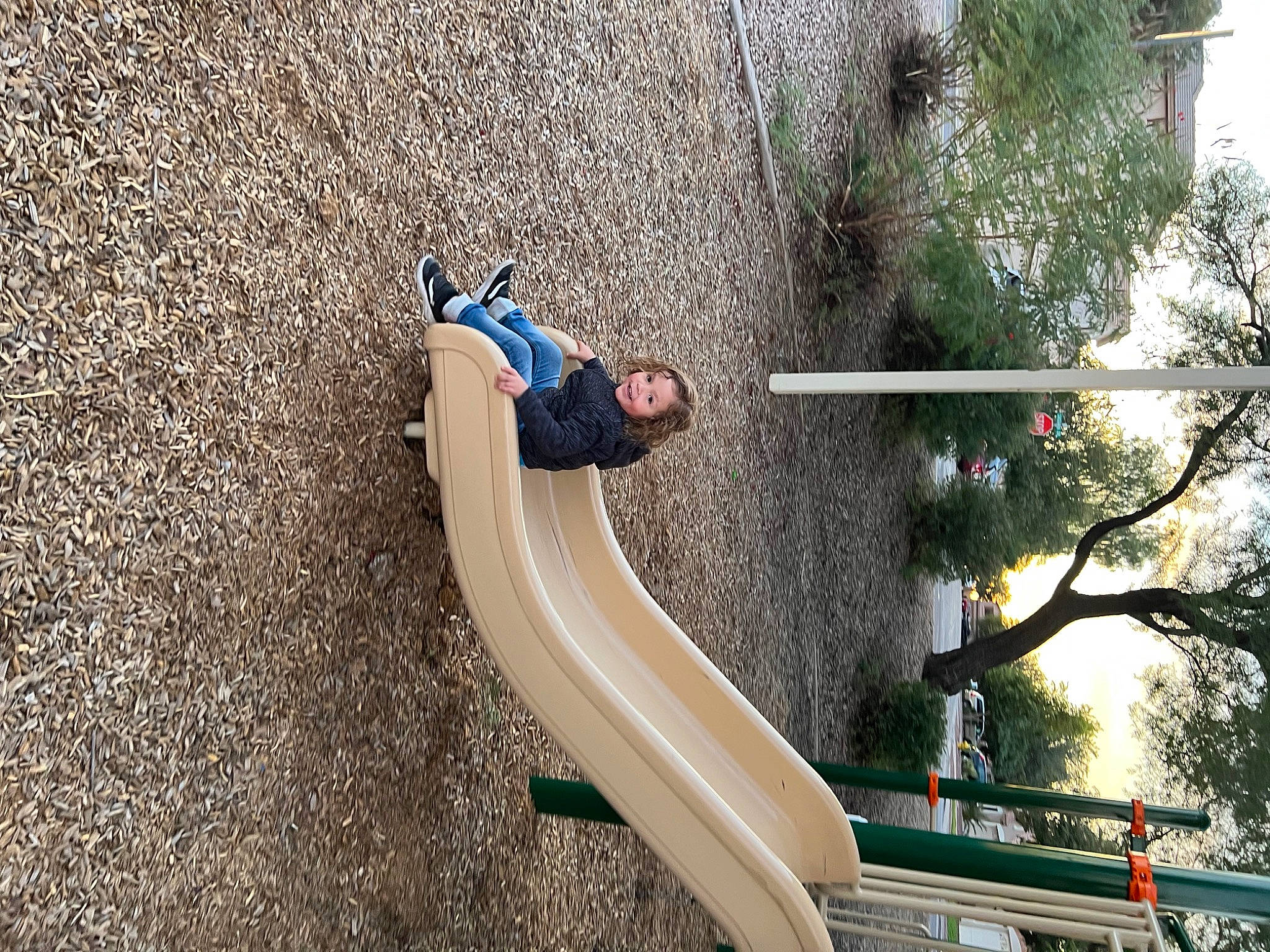 Ryker joined the competition — help win amazing prizes! chute, city, fun, grass, joy, landscape, leg, leisure, line, outdoor_play_equipment, outdoor_recreation, people_in_nature, person, plant, playground, playground_slide, recreation, shoe, sneakers, soil