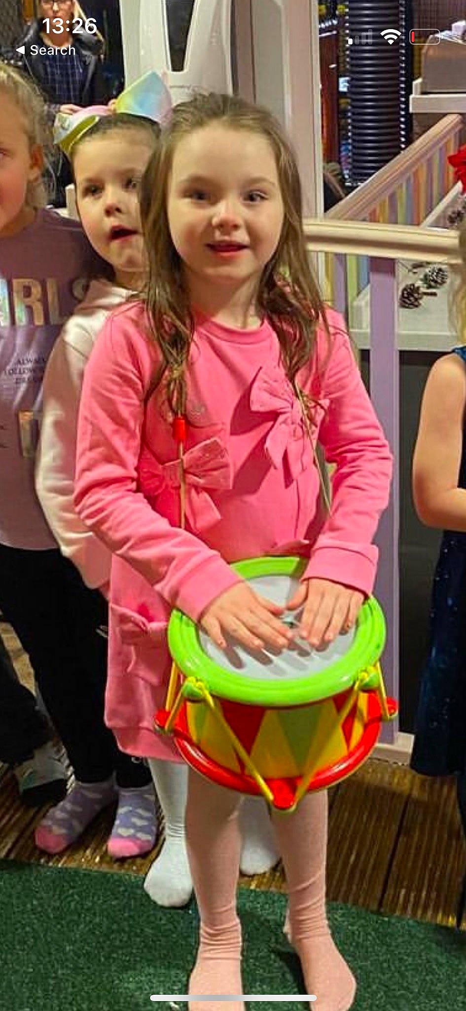Lucia is registered to the contest to win money with this photo: blond, child, community, event, facial_expression, fashion_design, fun, happy, human, idiophone, magenta, membranophone, pattern, person, pink, shoe, sleeve, smile, toddler, waist