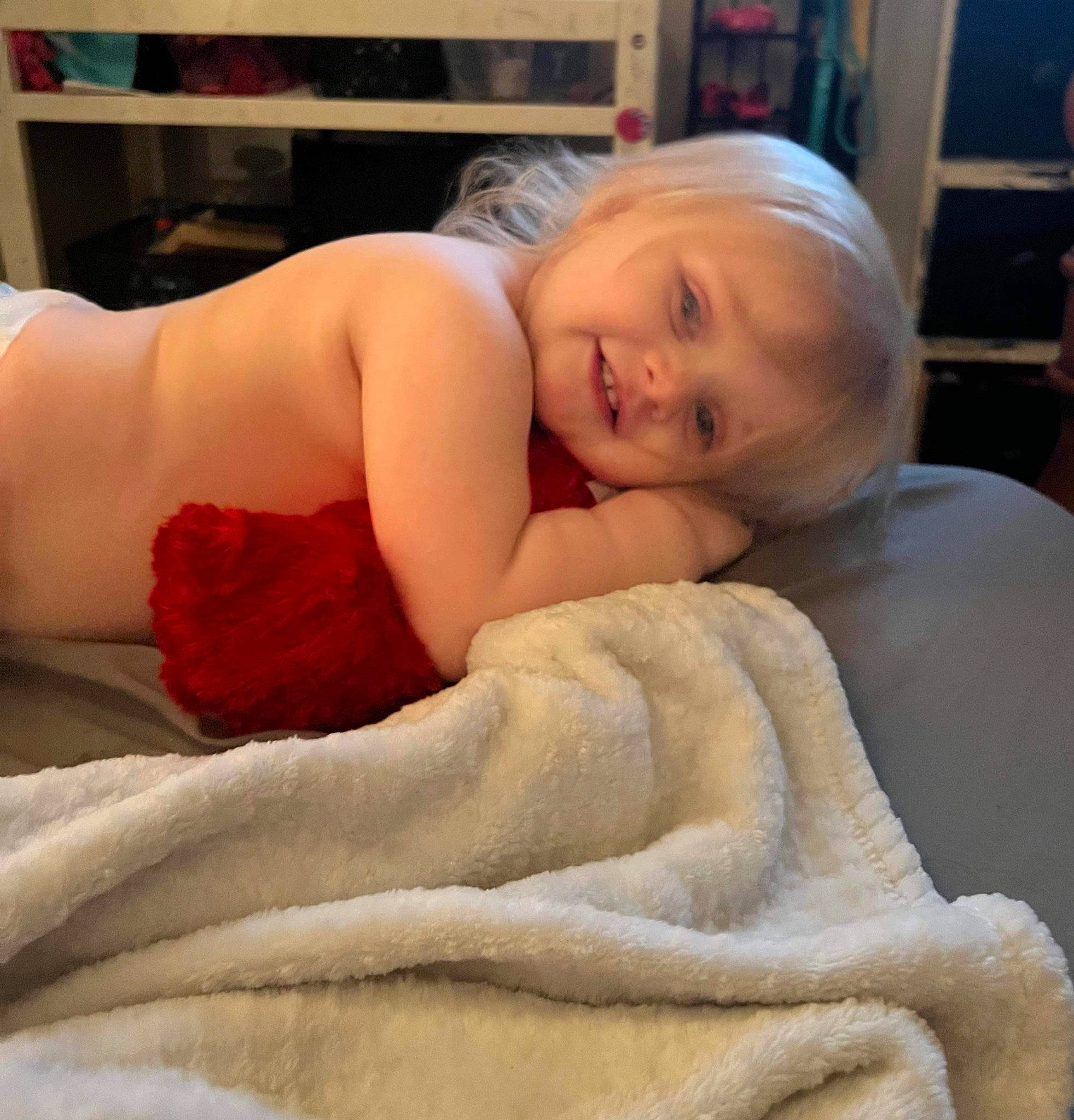Aliyah joined the competition — help win amazing prizes! abdomen, bed_sheet, bedding, chest, child, comfort, couch, facial_expression, flesh, flooring, fur, happy, human_leg, joy, linens, pattern, person, room, shoulder, sitting