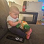 Israel joined the competition — help win amazing prizes! baby, infant, snack, bag, couch, remote_control, living_room, table, can, coca_cola, jeans, white_shirt, barefoot, floor, furniture, indoors, person, child, foot, television