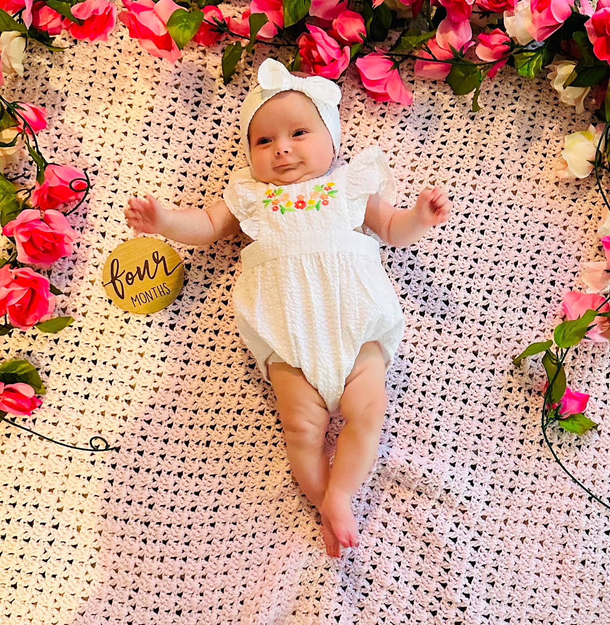 Tatum joined the competition — help win amazing prizes! baby_toddler_clothing, beauty, dress, eye, flower, foot, grass, happy, human_body, human_leg, leaf, people_in_nature, person, petal, pink, plant, rose, smile, textile, thigh