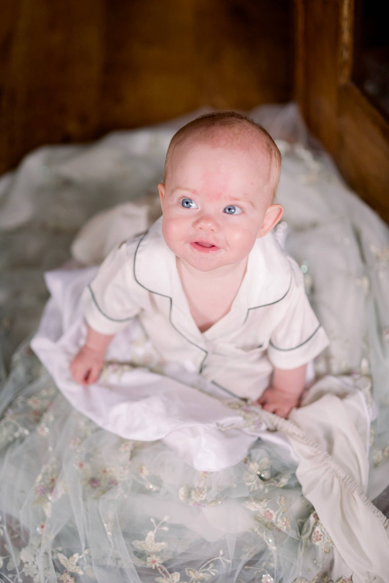 Alice is registered to the contest to win money with this photo: baby, baby_toddler_clothing, cheek, child, comfort, dress, eye, face, flash_photography, flooring, happy, head, iris, linens, person, product, skin, sleeve, smile, toddler