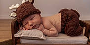 Walker joined the competition — help win amazing prizes! baby, newborn, sleeping, knitted_hat, knitted_pants, antlers, wooden_bed, pillow, cozy, cute, infant, sleep, portrait, indoors, soft_lighting, baby_clothing, child, rest, adorable, peaceful