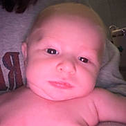 Walker joined the competition — help win amazing prizes! baby, child, face, skin, person, human, closeup, indoor, portrait, young, infant, expression, head, shoulder, holding, casual, light, human_face, newborn, cute