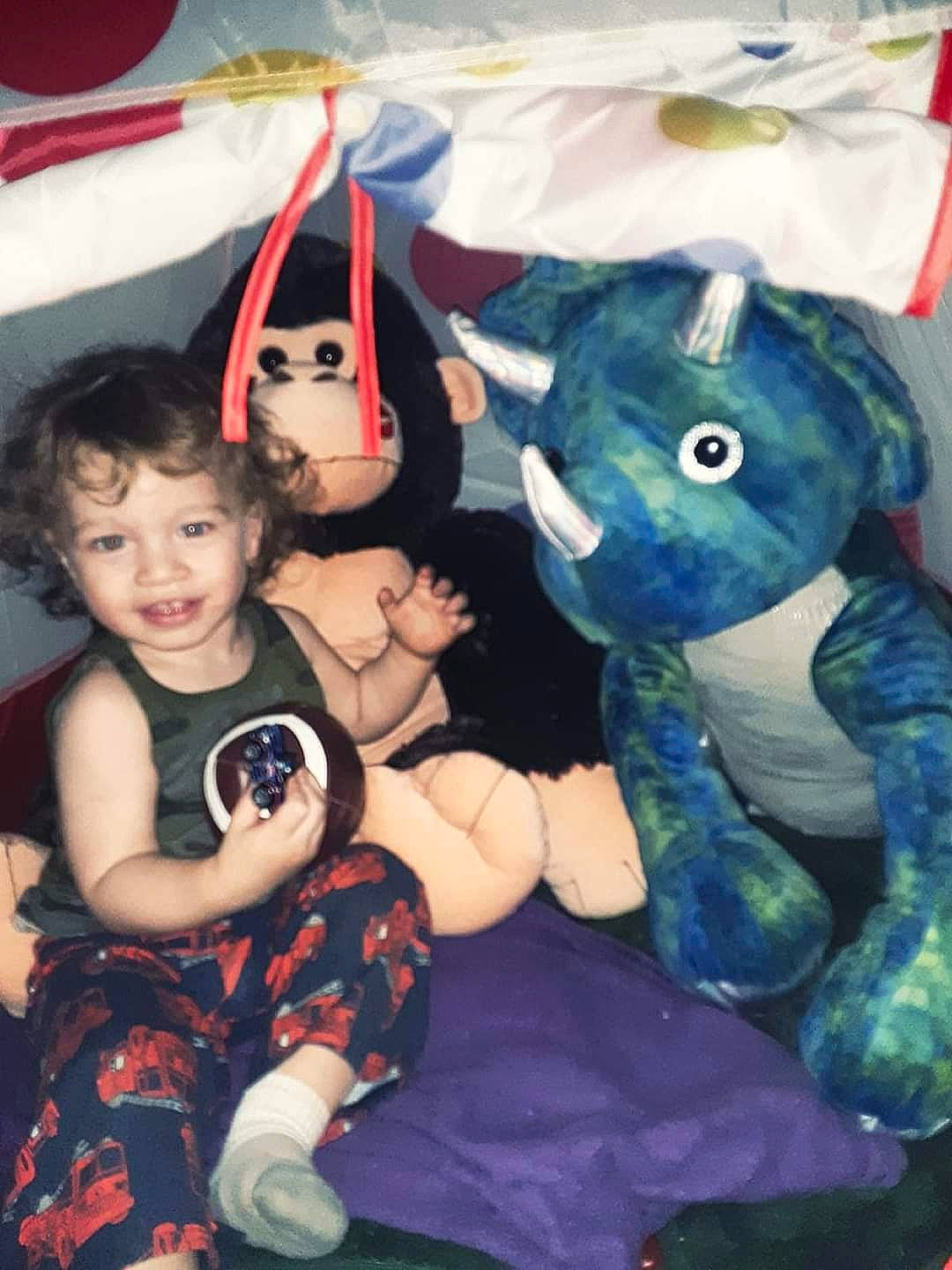 Danny joined the competition — help win amazing prizes! baby, child, costume, event, fictional_character, fun, fur, happy, joy, lap, mammal, pattern, person, pink, plush, sitting, snapshot, stuffed_toy, t_shirt, textile