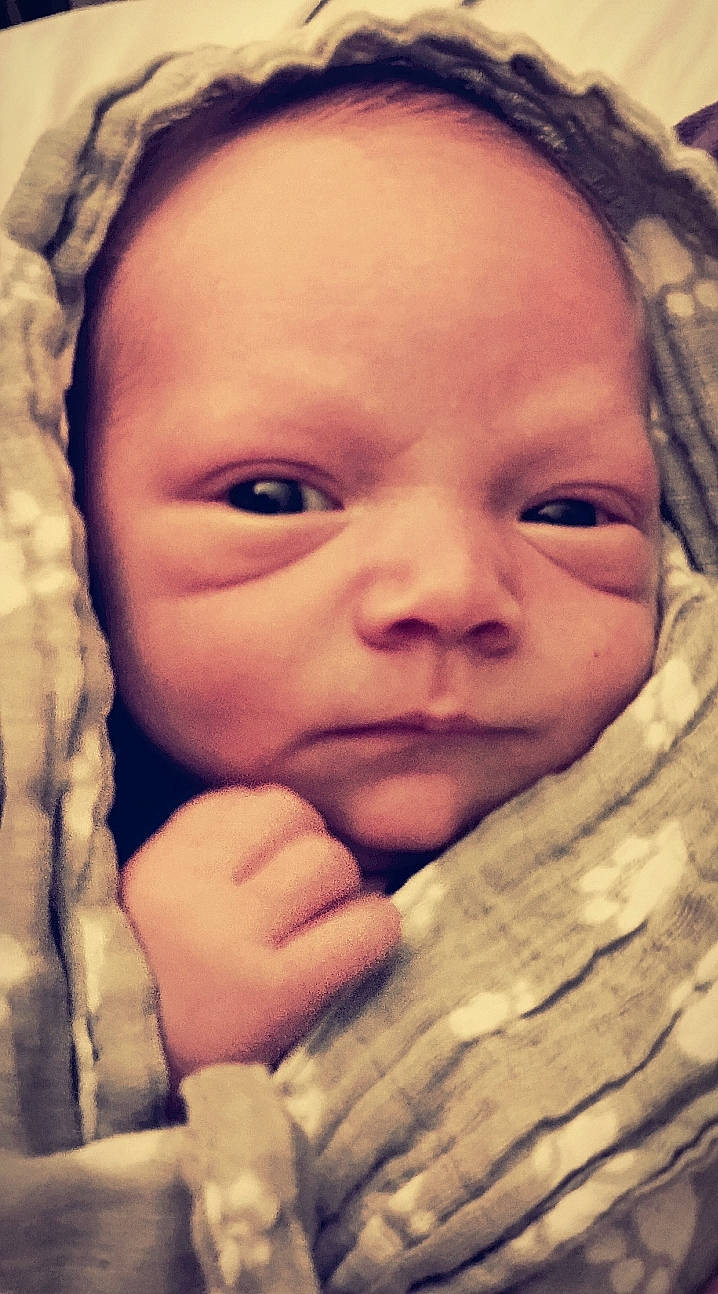 Bret is registered to the contest to win money with this photo: baby, cheek, chin, comfort, eye, eyebrow, face, finger, forehead, gesture, happy, head, human, iris, lip, mouth, nose, organ, person, product