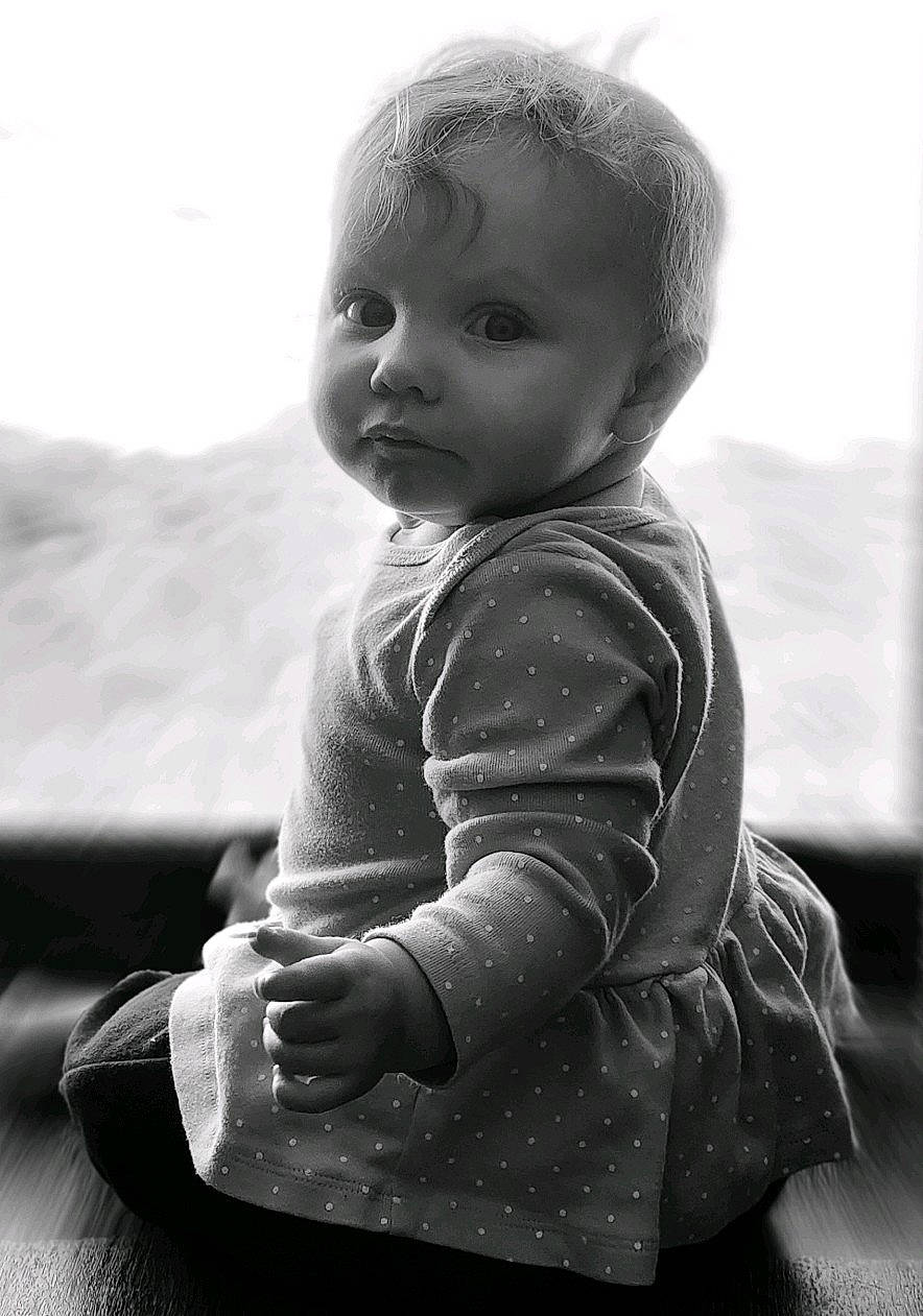 Alessandra is registered to the contest to win money with this photo: baby, baby_toddler_clothing, black_and_white, cheek, child, eye, flash_photography, fun, gesture, happy, head, human_body, iris, monochrome, monochrome_photography, person, skin, sleeve, standing, style