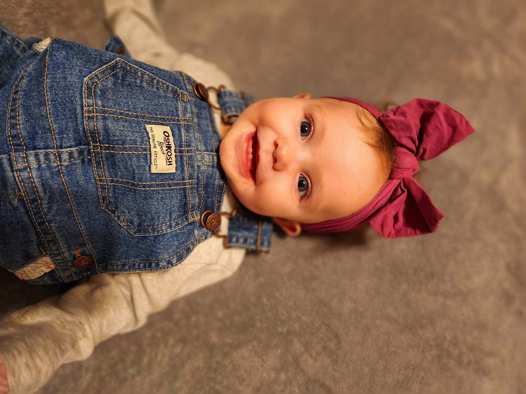 Alessandra is registered to the contest to win money with this photo: baby, baby_toddler_clothing, cheek, eye, flash_photography, hand, happy, hat, head, human_body, iris, joy, mouth, nose, outerwear, pattern, person, skin, sleeve, smile