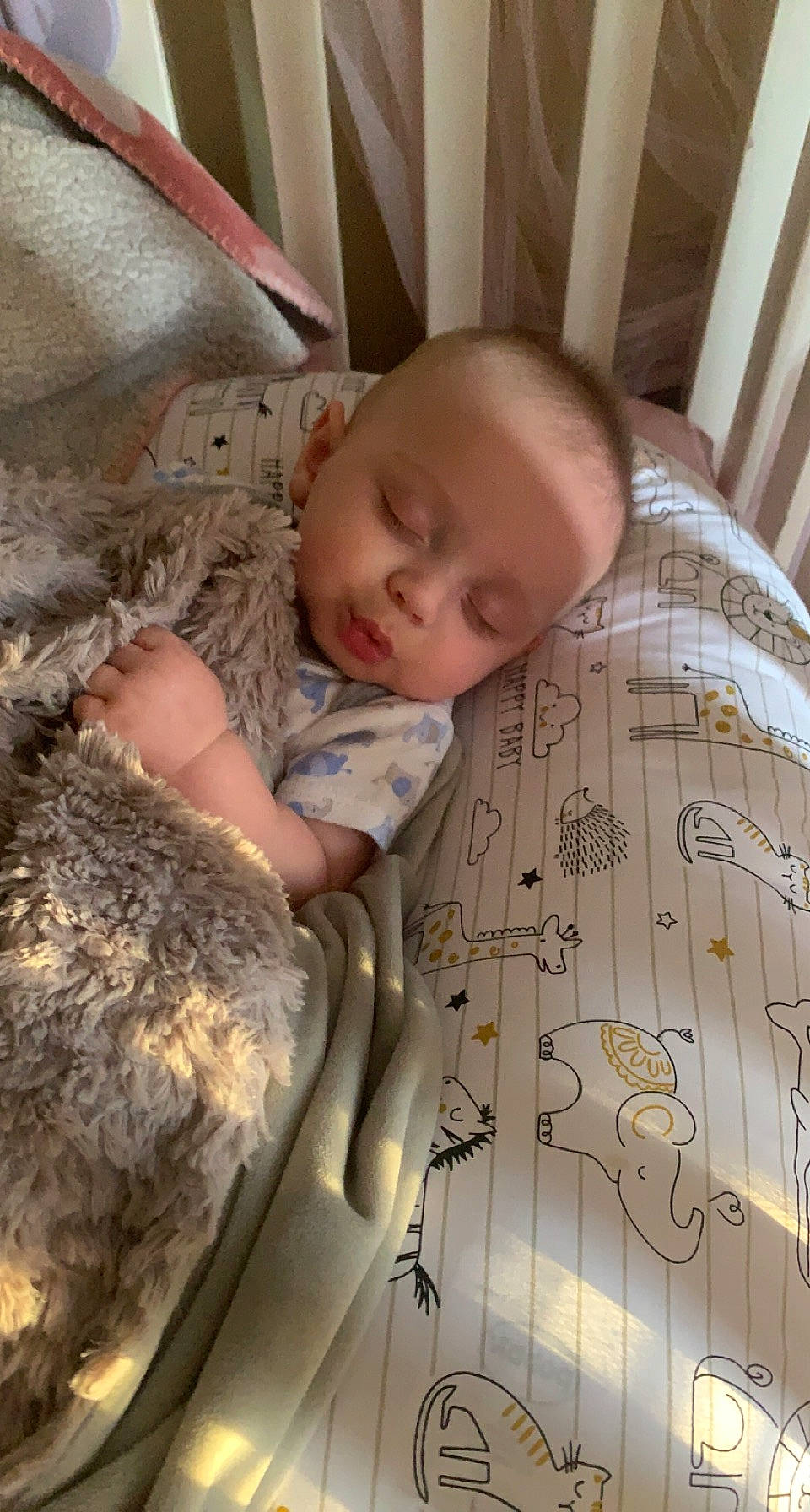 Kendrick is registered to the contest to win money with this photo: baby, baby_products, baby_safety, baby_sleeping, baby_toddler_clothing, bed, bedding, bedtime, child, comfort, flooring, fur, infant_bed, linens, military_camouflage, pattern, person, room, skin, textile