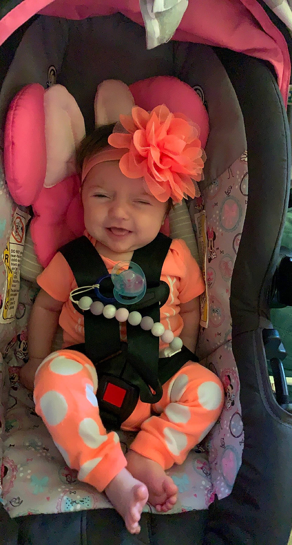 Annalee is registered to the contest to win money with this photo: automotive_exterior, baby, baby_products, baby_toddler_clothing, car_seat, child, comfort, cool, facial_expression, family_car, flower, fun, happy, headwear, pattern, person, pink, sitting, smile, toddler