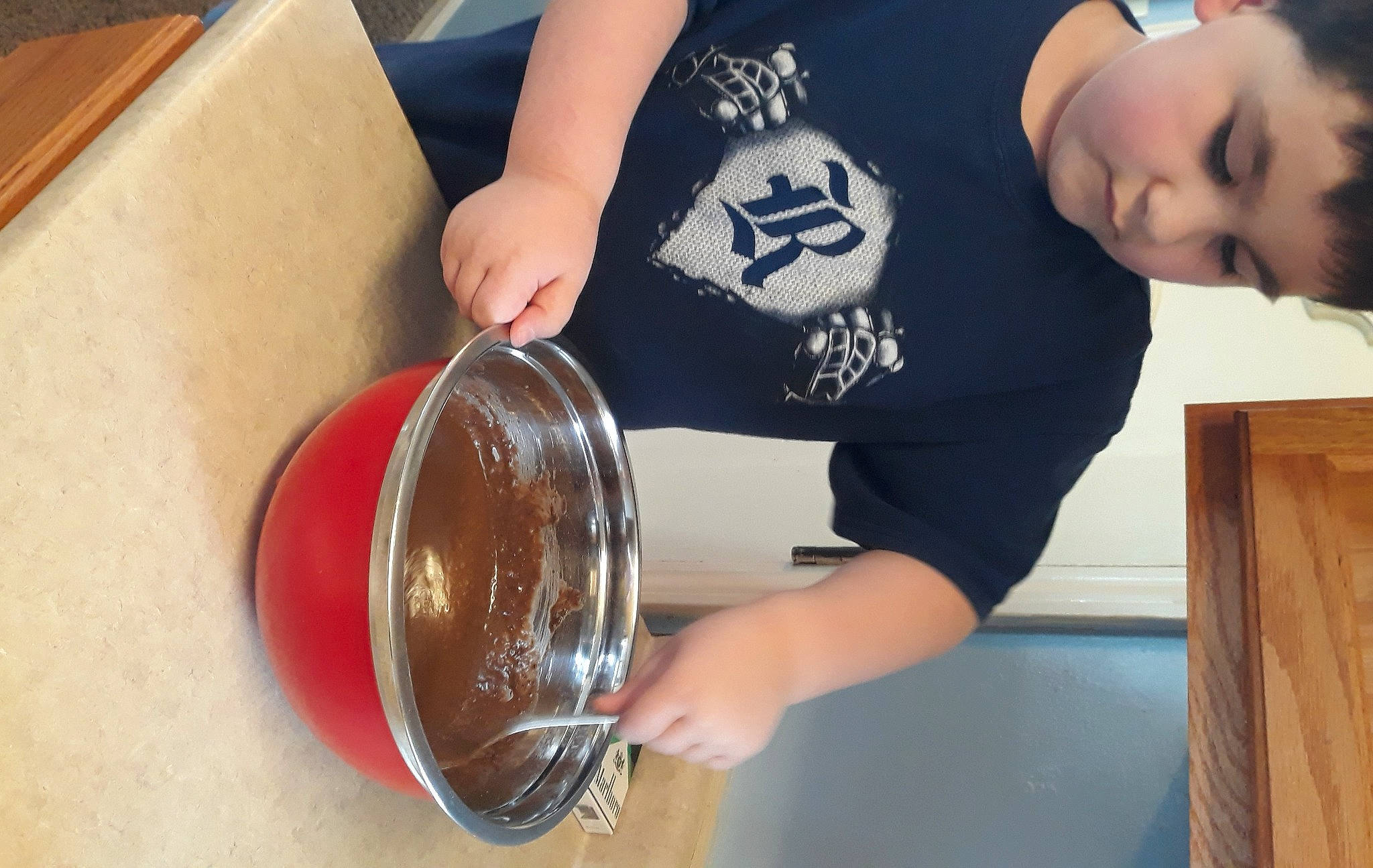 Elijah joined the competition — help win amazing prizes! box, cooking, cuisine, cutlery, drink, drinkware, elbow, fluid, fun, glass, kitchen_utensil, person, serveware, shipping_box, sleeve, spoon, t_shirt, tableware, toddler, wood