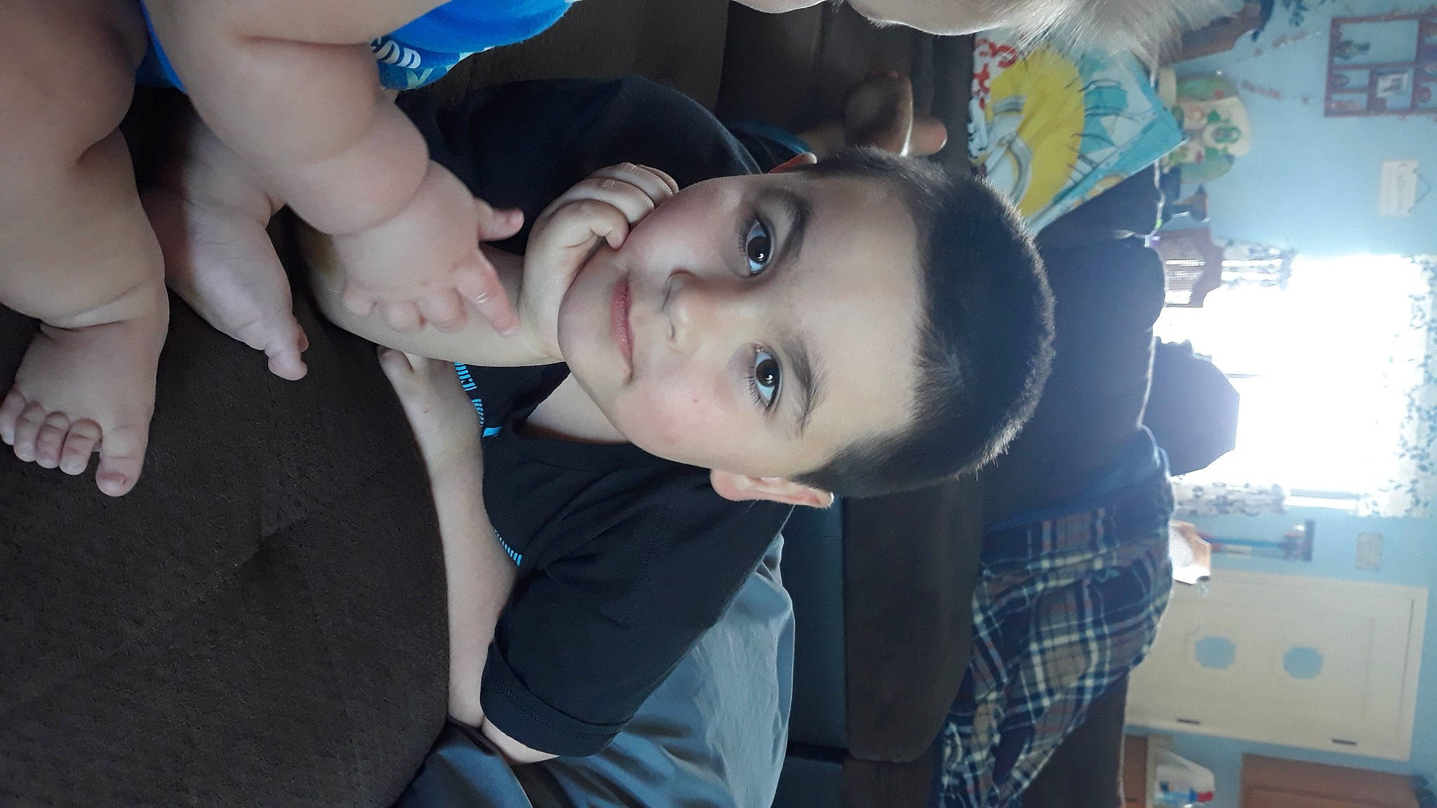 Elijah is registered to the contest to win money with this photo: black_hair, blue, cheek, cool, ear, elbow, electric_blue, eyelash, flash_photography, fun, gesture, happy, iris, jaw, mouth, nose, organ, person, plaid, tartan