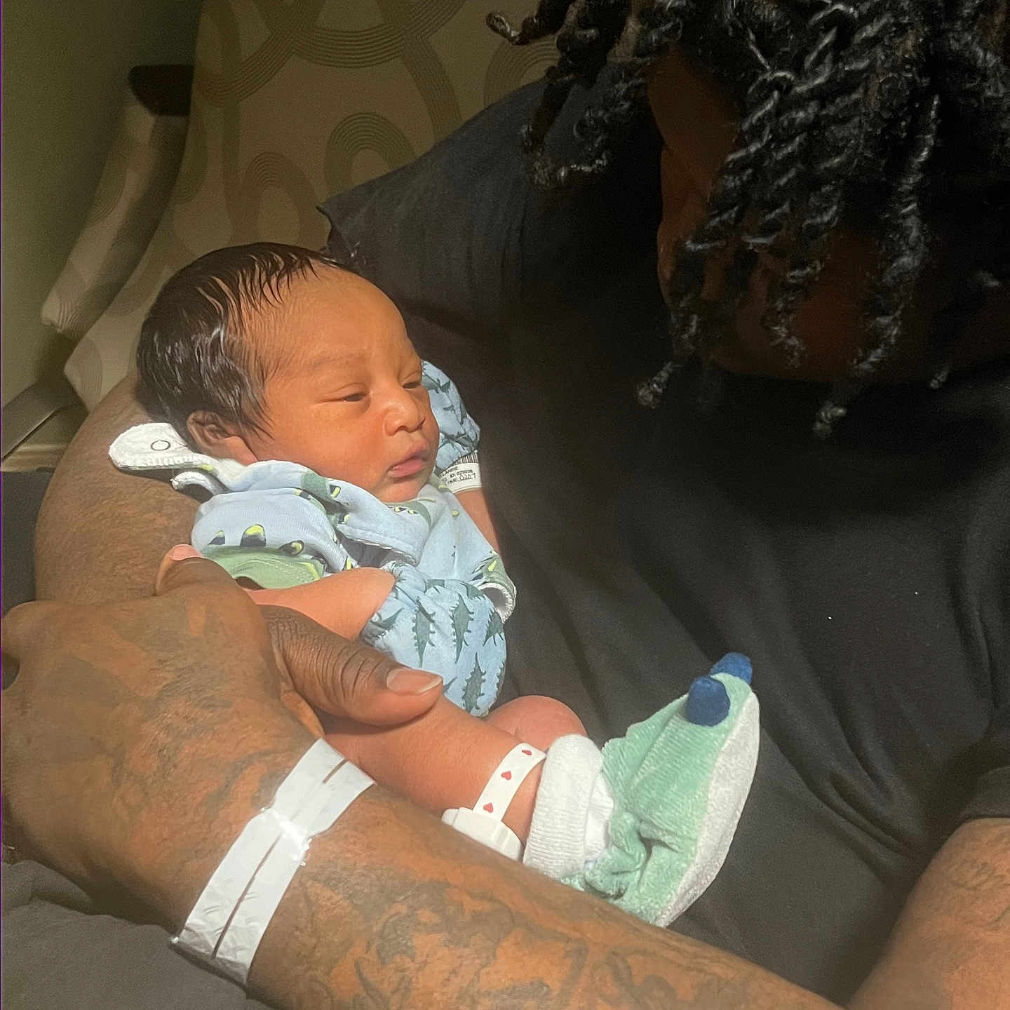 Kymier joined the competition — help win amazing prizes! adult, arm, baby, care, chair, closeup, clothing, family, hair, holding, hospital_bracelet, indoors, love, newborn, person, portrait, skin, sleeping, socks, tattoo