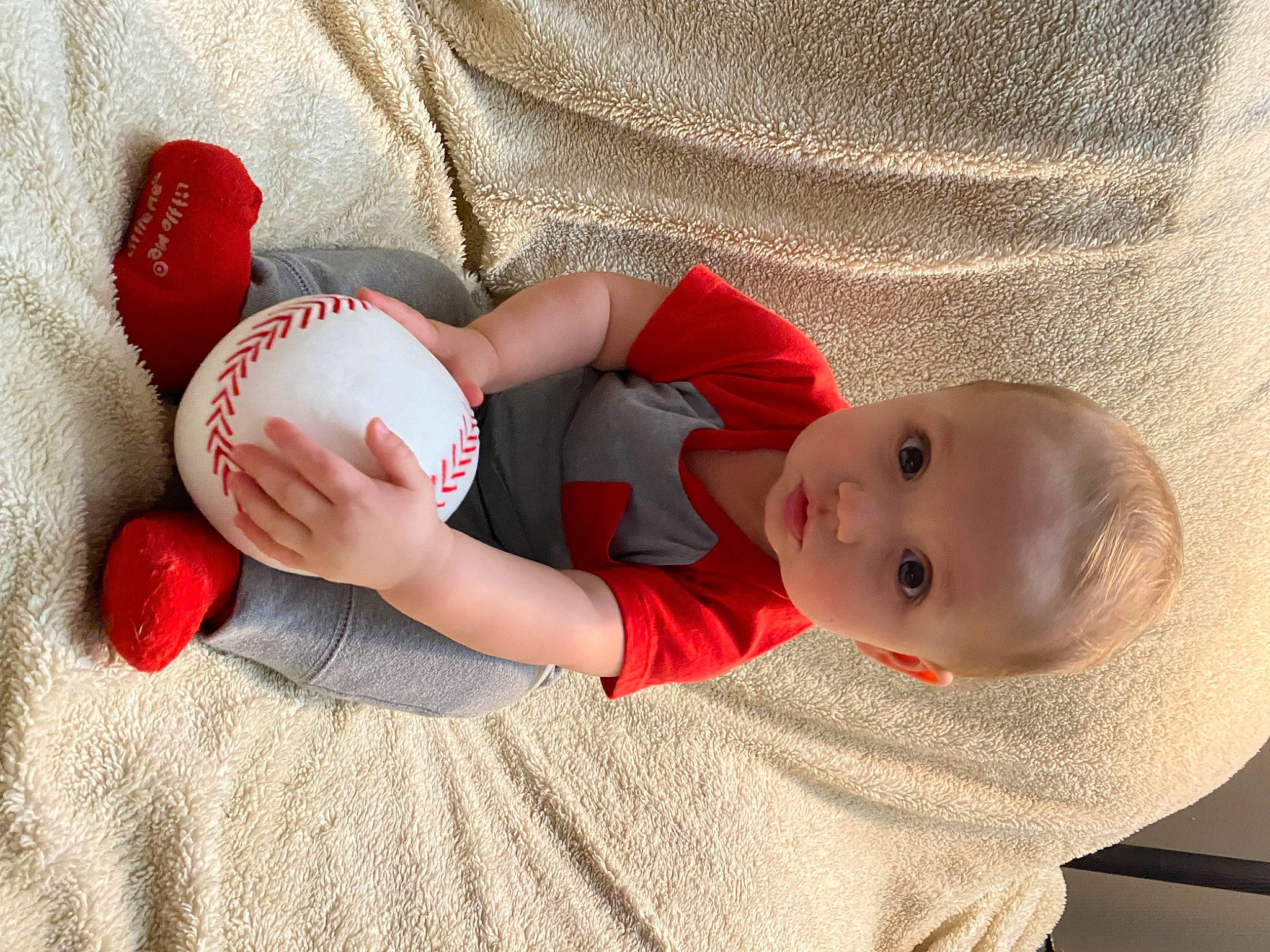 Koleson is registered to the contest to win money with this photo: arm, baby, baby_sleeping, baby_toddler_clothing, ball, ball_game, baseball, bat_and_ball_games, comfort, elbow, face, finger, gesture, hand, human_body, leg, person, playing_sports, sports_equipment, sports_gear