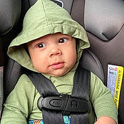 Aaron joined the competition — help win amazing prizes! baby, child, car_seat, green_hoodie, straps, infant, cute, face, hand, seatbelt, safety, clothing, portrait, indoors, young_child, expressive_eyes, hood, casual_wear, closeup, person