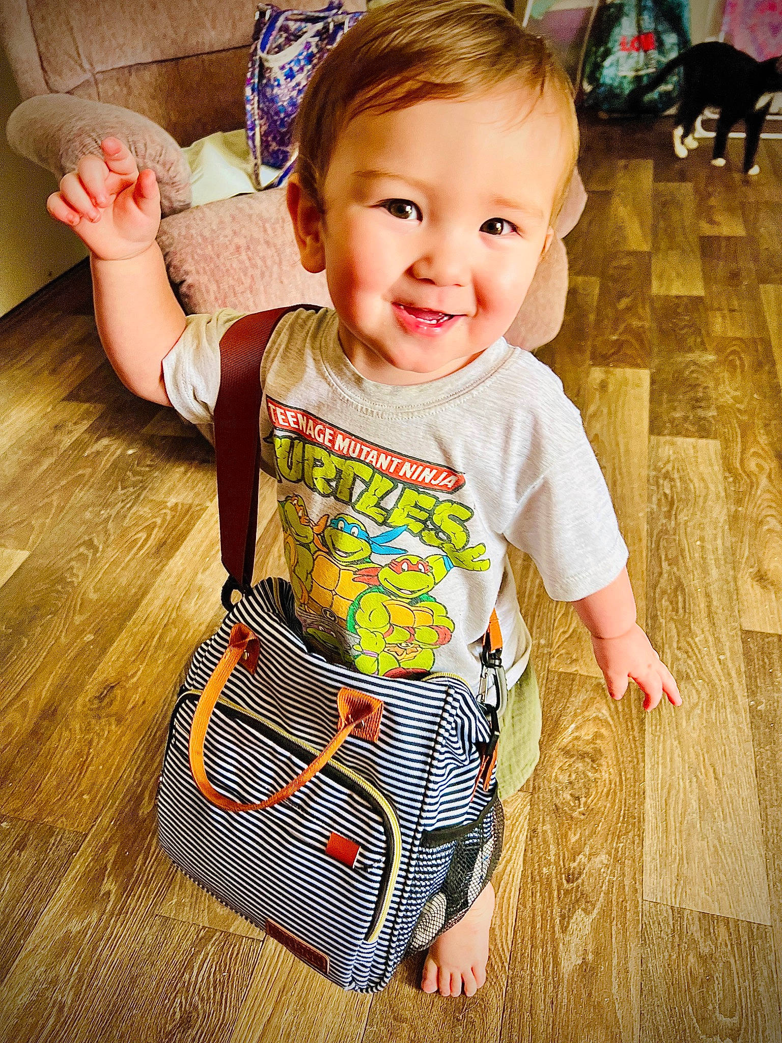 Ronin is registered to the contest to win money with this photo: baby, baby_toddler_clothing, child, cool, fashion_accessory, flooring, fun, hairstyle, happy, hardwood, joy, pattern, people, person, sitting, skin, sleeve, smile, standing, t_shirt