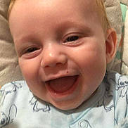 Kieran John is registered to the contest to win money with this photo: baby, smiling, infant, onesie, blanket, cute, happy, face, child, closeup, young, soft, cozy, indoors, portrait, person, skin, expression, comfort, joy