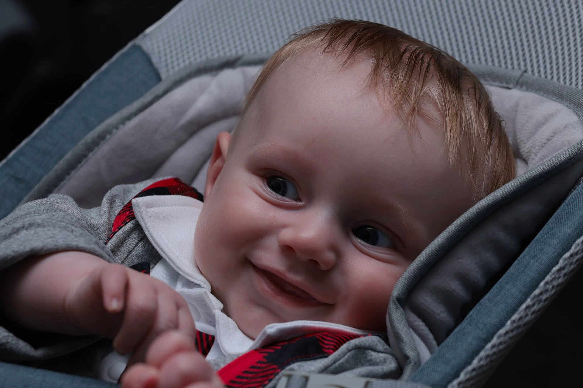 Kieran John joined the competition — help win amazing prizes! baby, child, closeup, clothing, cozy, cushion, cute, eyes, face, grey, hand, happy, head, infant, portrait, red, seat, skin, smiling, young