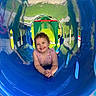 Scarlett is registered to the contest to win money with this photo: amusementpark, baby, car, face, grass, head, indoors, outdoorplayarea, outdoors, person, photography, plant, playarea, portrait, slide, summer, toy, transportation, vehicle, water