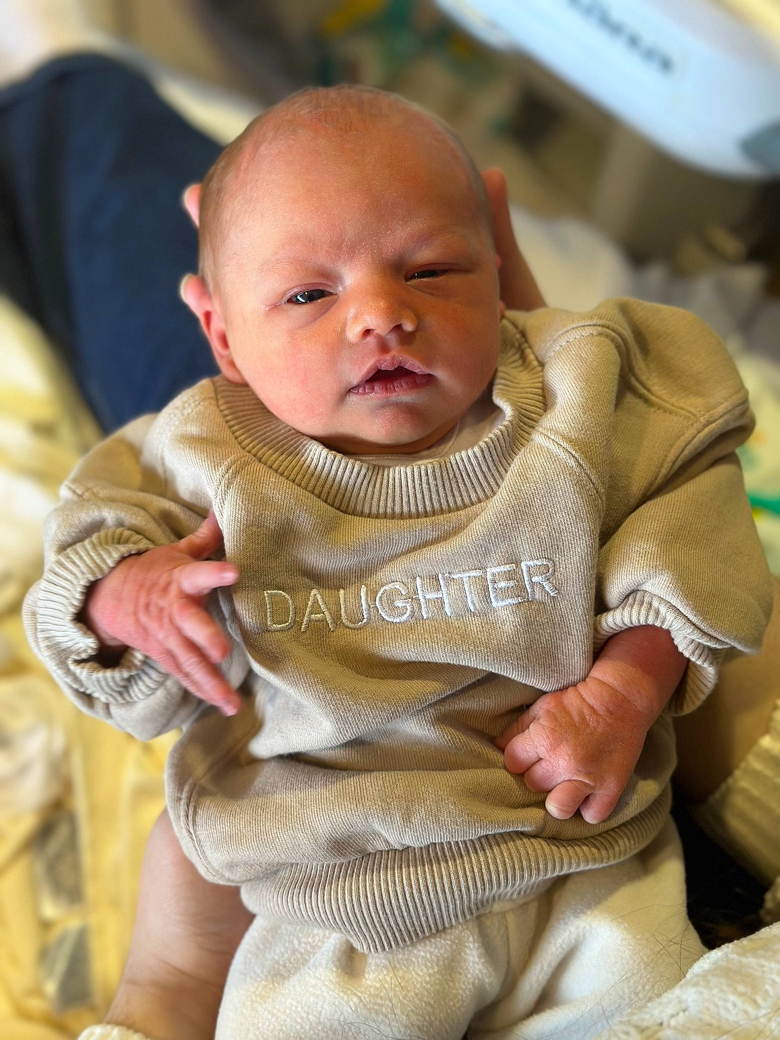 Brynlee is registered to the contest to win money with this photo: baby, baby_toddler_clothing, chair, cheek, child, comfort, fun, happy, head, iris, jewellery, linens, lip, necklace, person, sitting, skin, sleeve, toddler, tradition