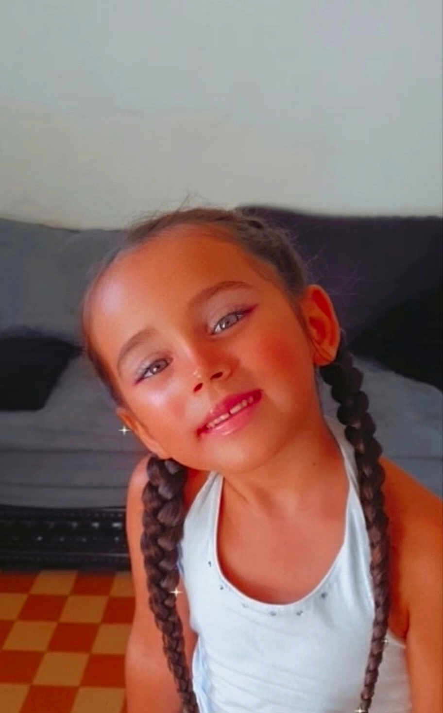May Lynn participe au concours pour gagner de l'argent avec cette photo : braid, bright, casual_clothing, child, childhood, cute, eyes, face, girl, hair, happy, home, indoor, person, portrait, pretty, seated, skin, smile, young