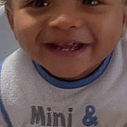 Kevin Davis is registered to the contest to win money with this photo: baby, child, smiling, bib, clothing, face, portrait, indoor, cute, happy, person, infant, teeth, closeup, young, expression, skin, head, cheerful, casual