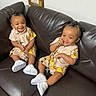 toddlers, children, smiling, matching_outfits, sneakers, couch, indoor, happy, hair, clothing, person, seated, leather, brown, cute, playful, infant, two_people, young, casual