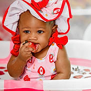 Anaya joined the competition — help win amazing prizes! baby, child, strawberry, milk_bath, pink, red, hat, bonnet, fruit, playful, cute, sitting, milk, water, tub, infant, smiling, food, portrait, fun