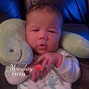 Xavier is registered to the contest to win money with this photo: baby, infant, child, portrait, sleepy, sitting, plush_toy, bunny, stuffed_animal, chair, cushion, onesie, pajamas, clothing, indoors, close_up, face, hands, monday, date_stamp