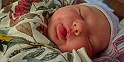 Emberlynn is registered to the contest to win money with this photo: newborn, baby, sleeping, blanket, hat, face, infant, cozy, soft, closeup, cute, child, rest, peaceful, wrapped, apparel, skin, mouth, headwear, indoors