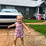 toddler, child, barefoot, romper, pink, smiling, running, driveway, car, house, grass, outdoor, daytime, happy, person, clothing, window, door, grill, trash_bin