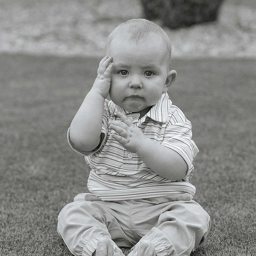Bennett joined the competition — help win amazing prizes! baby, bodypart, clothing, face, finger, grass, hand, happy, head, lawn, outdoors, pants, person, photography, plant, portrait, shorts, sitting, smile, tree