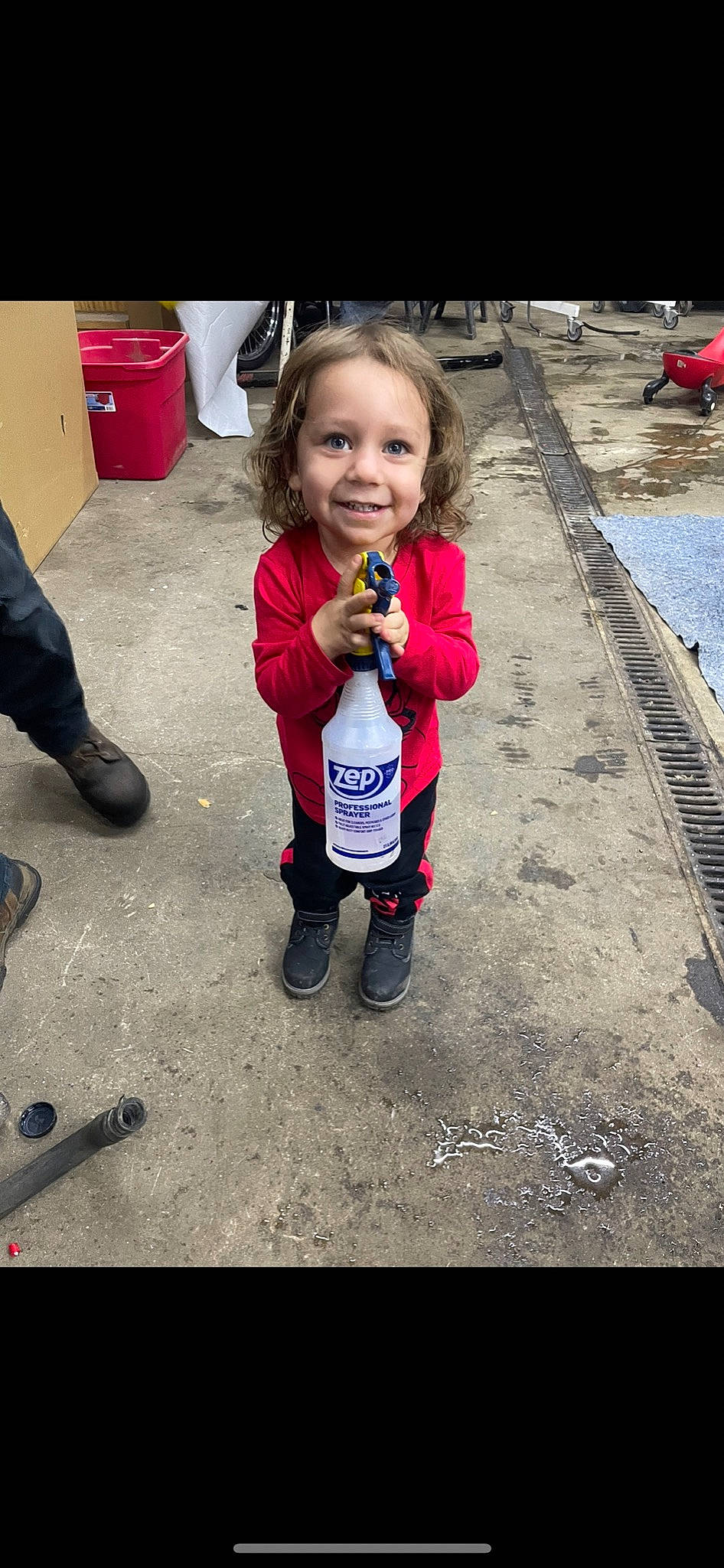 Oakley is registered to the contest to win money with this photo: asphalt, child, drink, eye, floor, flooring, fun, hairstyle, happy, joy, leg, person, recreation, road_surface, shoe, smile, snapshot, sneakers, soil, standing