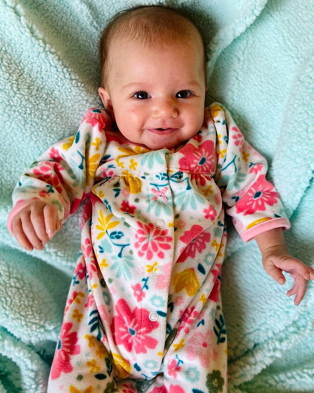 Kailey joined the competition — help win amazing prizes! baby, baby_products, baby_toddler_clothing, blanket, cheek, child, design, face, linens, outerwear, pattern, person, skin, sleeve, smile, textile, toddler