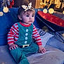 Layana a rejoint le concours — aidez-le/la à gagner de superbes lots ! child, toddler, baby, couch, pajamas, striped_clothing, elf_costume, headband, bokeh_effect, living_room, pillow, blanket, baby_bouncer, curtain, clothes_hanging, portrait, cute, indoor_lighting, seat, expression_surprised