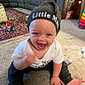 Poseidon joined the competition — help win amazing prizes! baby, beanie, carpet, child, clothing, couch, cute, foot, hand, happy, hat, indoor, infant, living_room, person, playful, sitting, smiling, toddler, toy