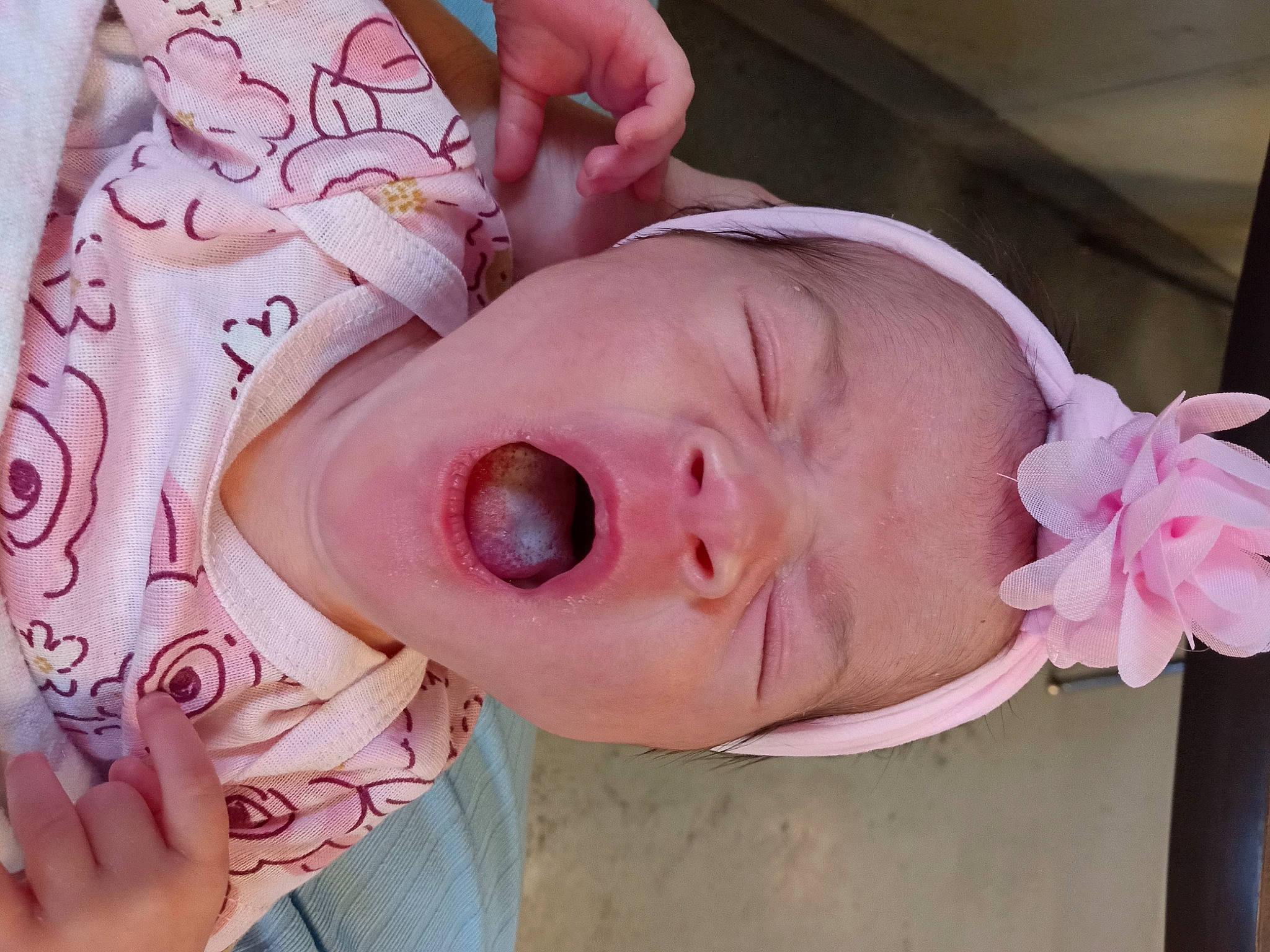 Annabelle is registered to the contest to win money with this photo: arm, baby, cheek, child, ear, eye, eyebrow, eyelash, finger, hand, head, human_body, lip, mouth, nail, neck, nose, person, pink, skin