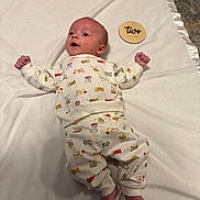 Ayden is registered to the contest to win money with this photo: baby, infant, two_months, pajamas, blanket, clothing, cute, lying_down, indoors, soft_texture, skin, feet, hands, face, expression, child, newborn, patterned_clothing, carpet, comfort