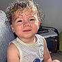 Ilan a rejoint le concours — aidez-le/la à gagner de superbes lots ! casual_clothing, child, couch, curly_hair, cute, happy, indoor, mickey_mouse, natural_light, person, portrait, relaxed, rosy_cheeks, sitting, smile, striped_clothing, tank_top, toddler, window_light, young_child