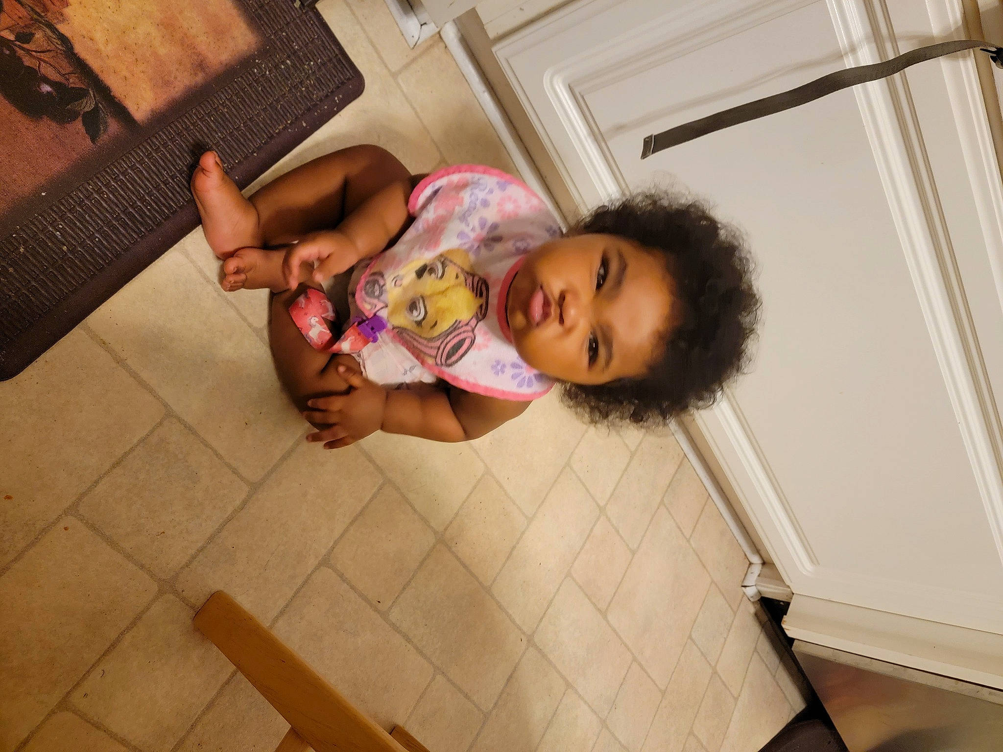 Anastasia is registered to the contest to win money with this photo: baby, child, comfort, finger, floor, flooring, foot, fun, happy, hardwood, human_leg, leisure, person, room, sitting, skin, sock, thigh, toddler, vacation