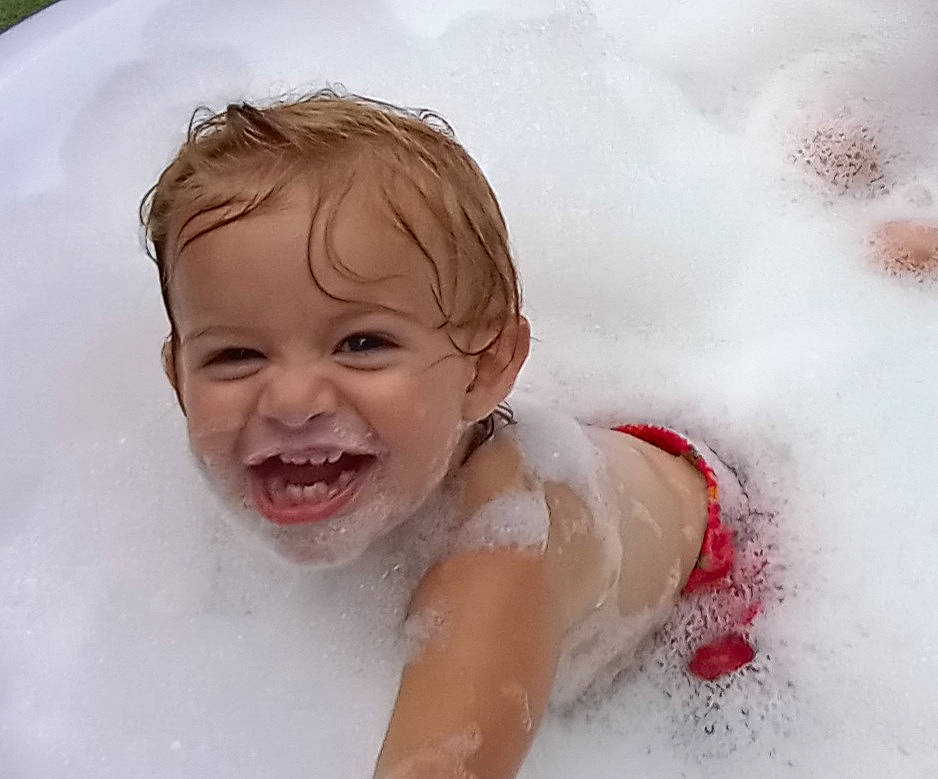 Amelia is registered to the contest to win money with this photo: bathing, cheek, child, eye, eyebrow, face, fluid, foam, freezing, fun, happy, head, jaw, leisure, nose, person, recreation, skin, smile, toddler