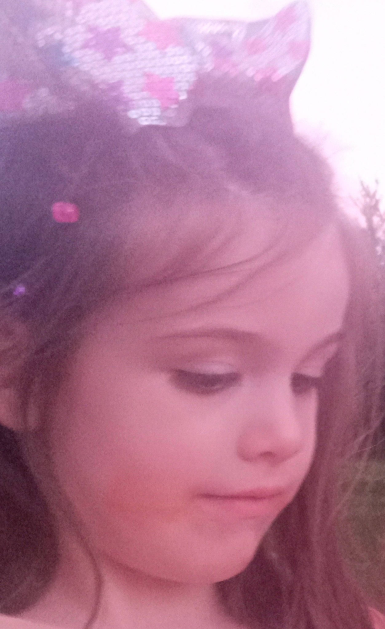 Adrian is registered to the contest to win money with this photo: black_hair, cheek, chin, ear, eyebrow, eyelash, face, forehead, grass, happy, headgear, iris, jaw, lip, neck, nose, person, pink, plant, purple