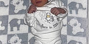Xayvièn joined the competition — help win amazing prizes! newborn, baby, sleeping, blanket, elephant_pattern, teddy_bear_pattern, white_clothing, infant, cute, peaceful, lying_down, soft_texture, portrait, indoors, child, small_hands, small_feet, cozy, warm, resting