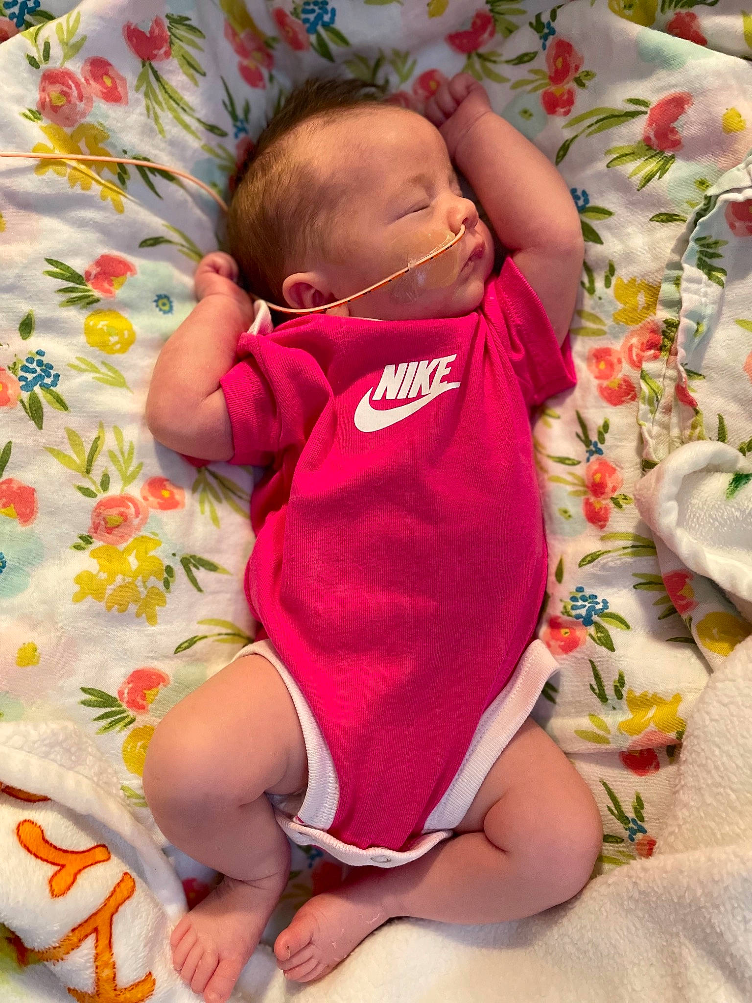 Araya joined the competition — help win amazing prizes! baby, baby_sleeping, baby_toddler_clothing, cheek, child, comfort, eye, finger, green, head, linens, mouth, orange, person, pink, product, skin, sleeve, textile, thigh