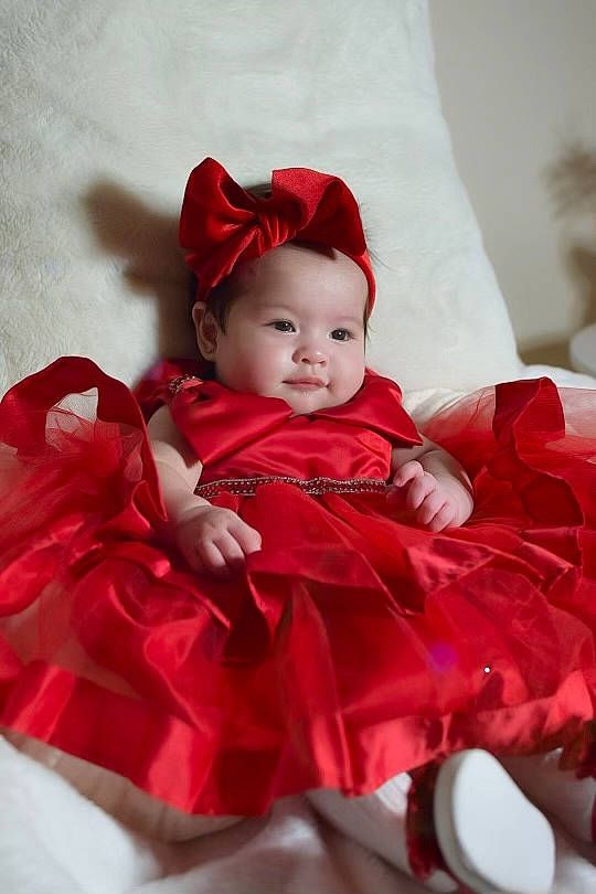 Mia joined the competition — help win amazing prizes! baby, baby_toddler_clothing, carmine, christmas, christmas_eve, costume, costume_hat, dress, event, flash_photography, happy, hat, holiday, magenta, person, petal, pink, sitting, sleeve, smile
