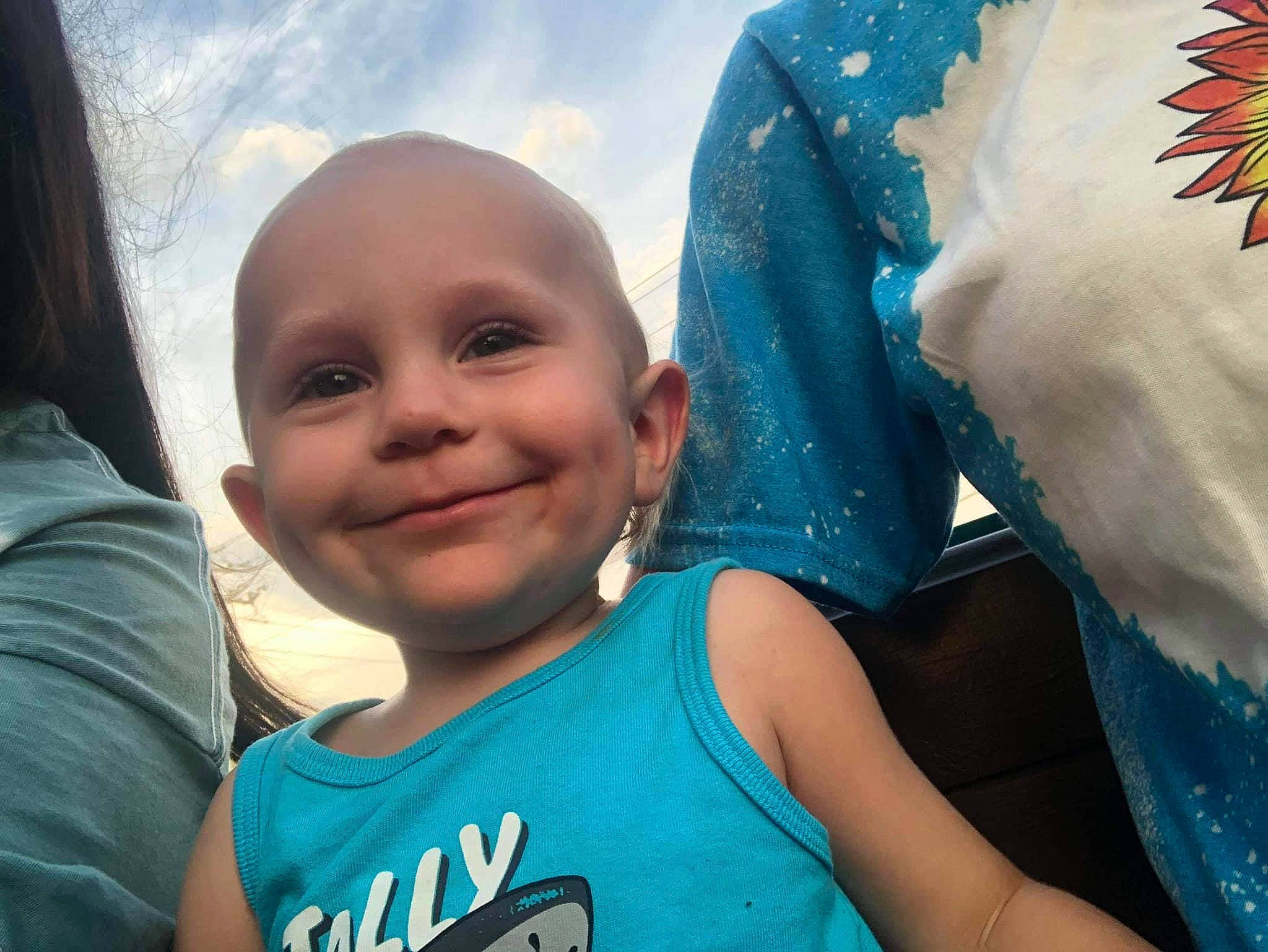 Brandon is registered to the contest to win money with this photo: azure, baby, blue, child, electric_blue, event, fun, gesture, happy, iris, joy, leisure, organ, people, person, recreation, sky, smile, t_shirt, toddler